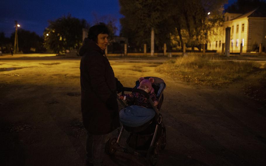 Natasha Nishchedim, 63, with her 18 month-old granddaughter, Maira, early on Saturday evening in Dnipro.