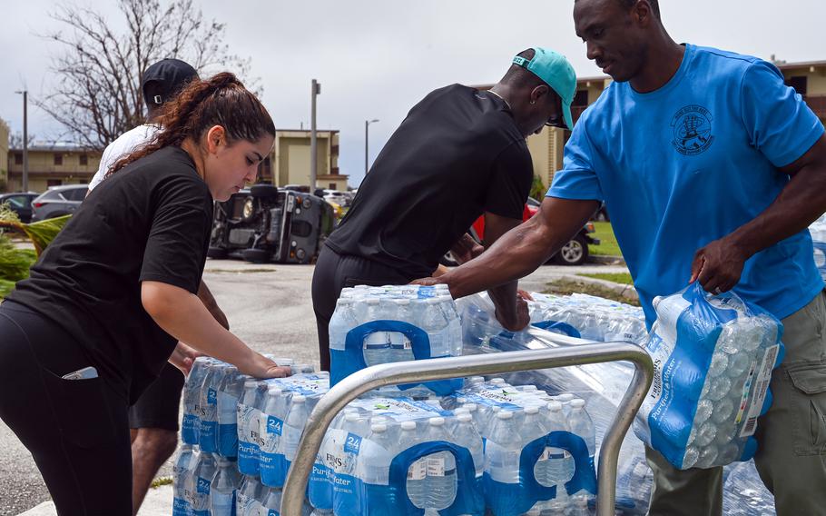 In the aftermath of Typhoon Mawar, members of the 36th Force Support Squadron unload cases of water for distribution at Andersen Air Force Base, Guam, Friday, May 26, 2023. 