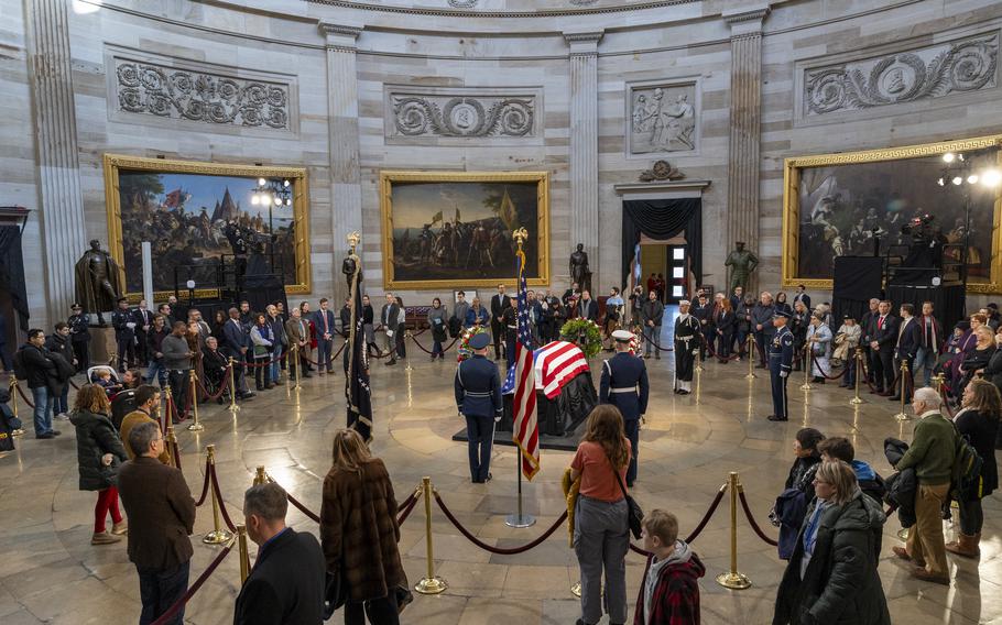 Mourners view former President Jimmy Carter lying in state in the Capitol.
