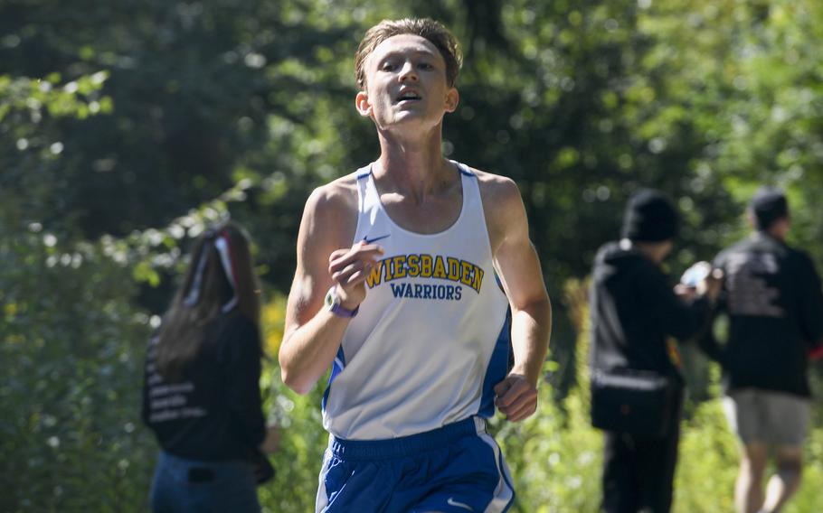 Zach Watts, a runner for Wiesbaden, goes all out during the finish of a cross country meet  in September2021, in Kaiserslautern, Germany.