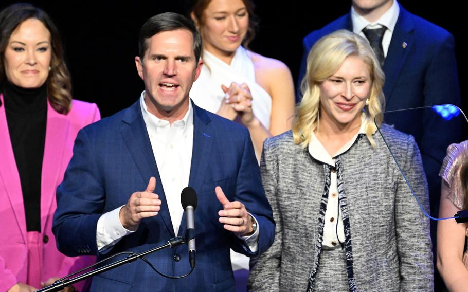 Kentucky incumbent Democratic Gov. Andy Beshear is joined by his wife, Britainy Beshear, right, as he delivers his victory speech to a crowd at an election night event at Old Forrester’s Paristown Hall on Nov. 7, 2023, in Louisville, Ky.