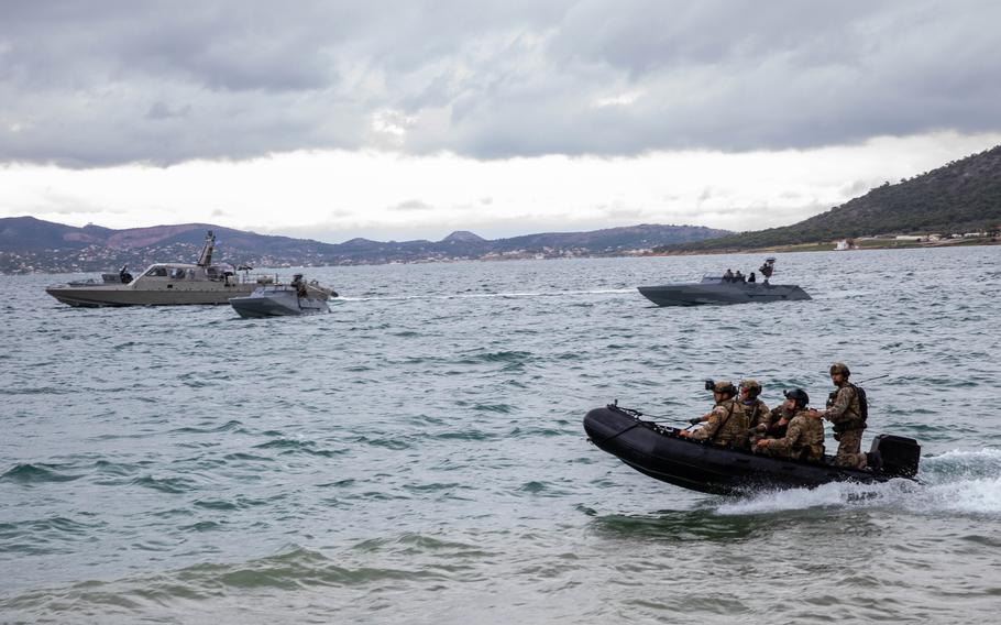 U.S. and Greek special operations forces maneuver during drills near Athens, Nov. 24, 2021. Navy SEALs and Army Green Berets were among the troops taking part in the exercises, which utilized U.S. vessels recently donated to Greek special warfare units. 