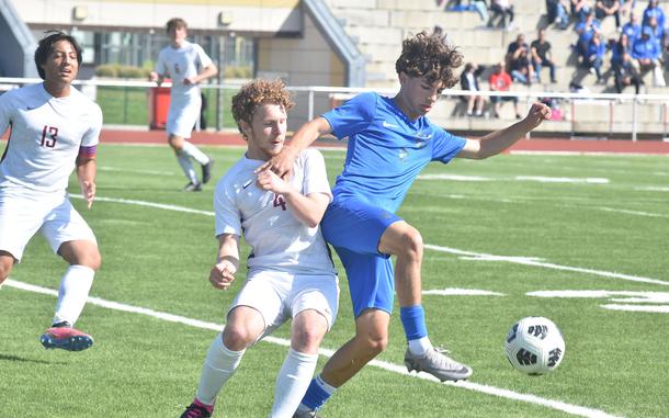 Ramstein's Keiran Goodall and Lakenheath's Joshua Gabel battle for the ball Monday, May 20, 2024, on the first day of the DODEA European Division I boys soccer championships at Kaiserslautern High School.