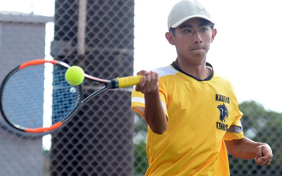 Kadena's Nathan Asato hits a forehand return against Kubasaki during Thursday's Okinawa mixed-doubles tennis matches. Asato and partner Mary Tracy beat Owen Ruksc and Noemi Ung 8-5.