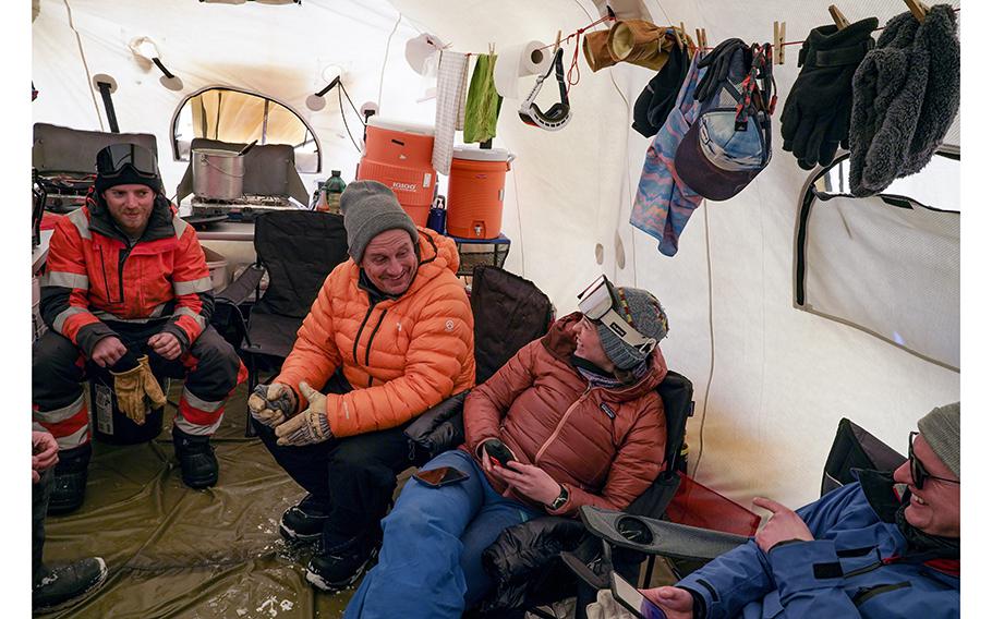 Joerg Schaefer, second from left, laughs with glacial geologist Allie Balter-Kennedy. 
