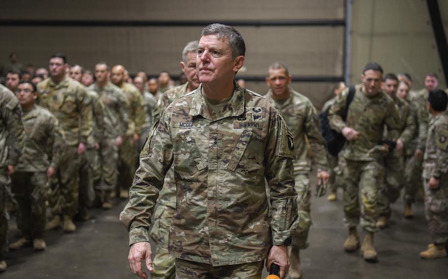 Maj. Gen. JP McGee, commander of the 101st Airborne Division, escorts Army Chief of Staff Gen. James McConville through a hangar at the Mihail Kogalniceanu Air Base, Romania on Dec. 16, 2022. Hundreds of soldiers were on hand to meet the Army’s top general. 