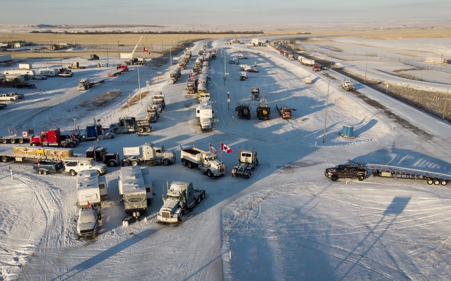 A truck convoy of anti-COVID-19 vaccine mandate demonstrators continue to block the highway at the busy U.S. border crossing in Coutts, Alberta., Canada, on Wednesday, Feb. 2, 2022. 