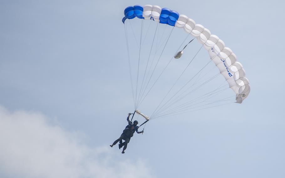 The United States Air Force Academy’s parachute team, Wings of Blue, along with Chief Master Sgt. Lucero Stockett, 437th Airlift Wing command chief, perform aerial displays during the Charleston Airshow at Joint Base Charleston, S.C., Saturday, April 20, 2024. The Wings of Blue parachute team kicked off the event hoisting service flags as they landed on the flight line. 