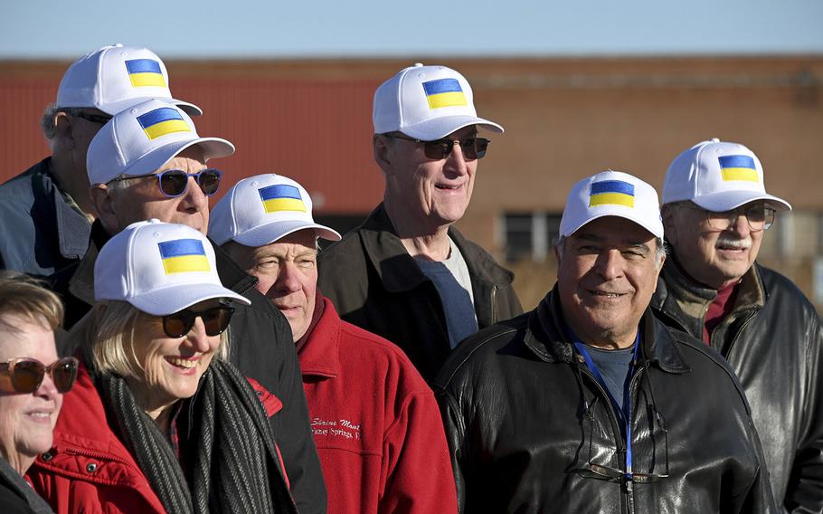 Volunteer drivers pose for a group photo after they drove reconditioned ambulances from Harrisonburg, Virginia to the Port of Baltimore so they could be shipped to Ukraine. 