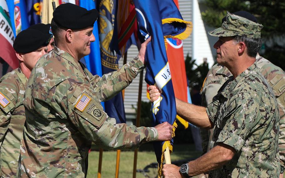 Gen. Charles A. Flynn, incoming U.S. Army Pacific commanding general, receives the command’s colors and assumes command of USARPAC from U.S. Navy Adm. John Aquilino, the commander of U.S. Indo-Pacific Command, at a change of command ceremony June 4, 2021, at Ft. Shafter, Hawaii. 