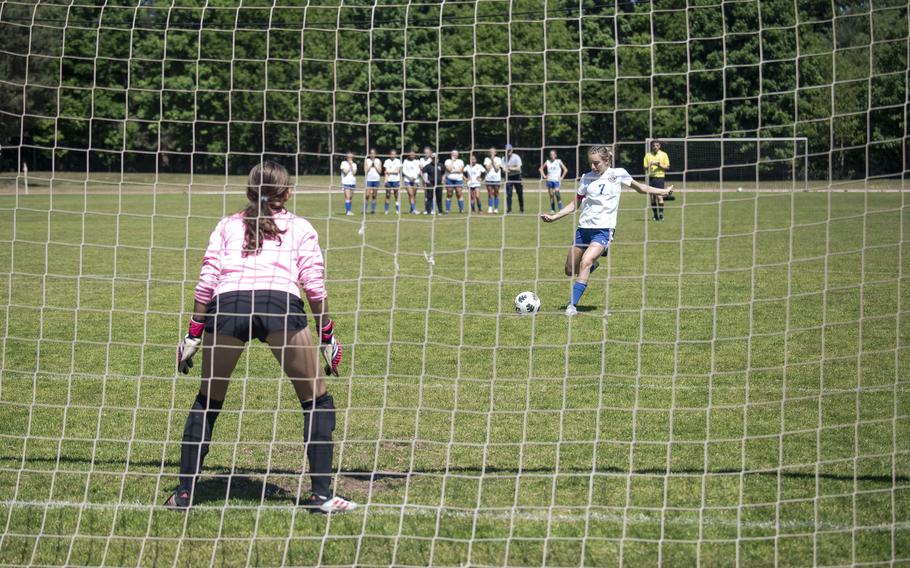 Kate Baird, a senior with the Brussels Brigands, takes a penalty kick against the Spangdahlem Sentinels during the 2025 DODEA European Division III soccer championships in Landstuhl, Germany on May 19, 2025.