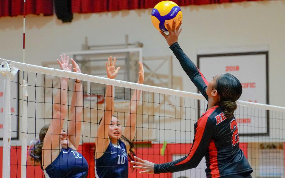 Adrianna Dogojo dinks the ball over the net.