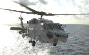 This undated photo released by and taken from the official website of the Japan Maritime Self-Defense Force,  shows a SH-60K chopper. Two Japanese navy helicopters of the same type crashed in the Pacific Ocean south of Tokyo during a nighttime training flight after possibly colliding with each other, the country's defense minister said Sunday, April 21, 2024. (The official website of the Japan Maritime Self-Defense Force via AP)