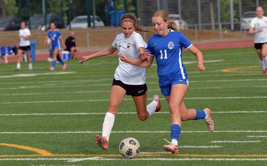 Ramstein’s Audrey Singer tries to get past Stuttgart’s Brya Henry in the Division I girls final at the DODEA-Europe soccer championships in Ramstein, Germany, May 22, 2025. The Royals beat the Panthers 3-1 to take the division crown.