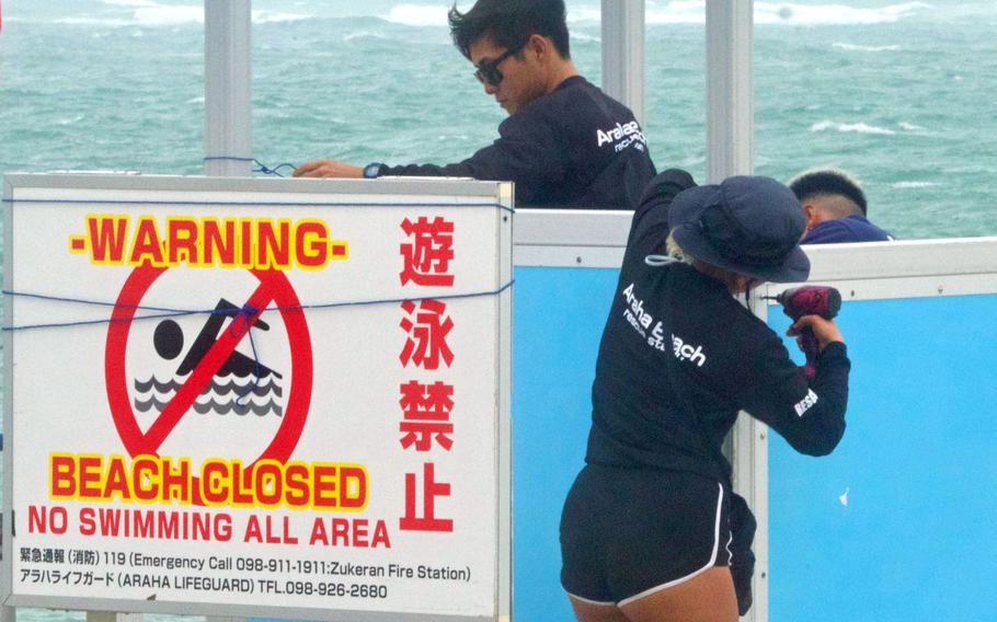 Lifeguards reassemble a lifeguard watch station at Araha Beach on Okinawa, Japan, on Aug. 7, 2023, after Typhoon Khanun passed near the island.