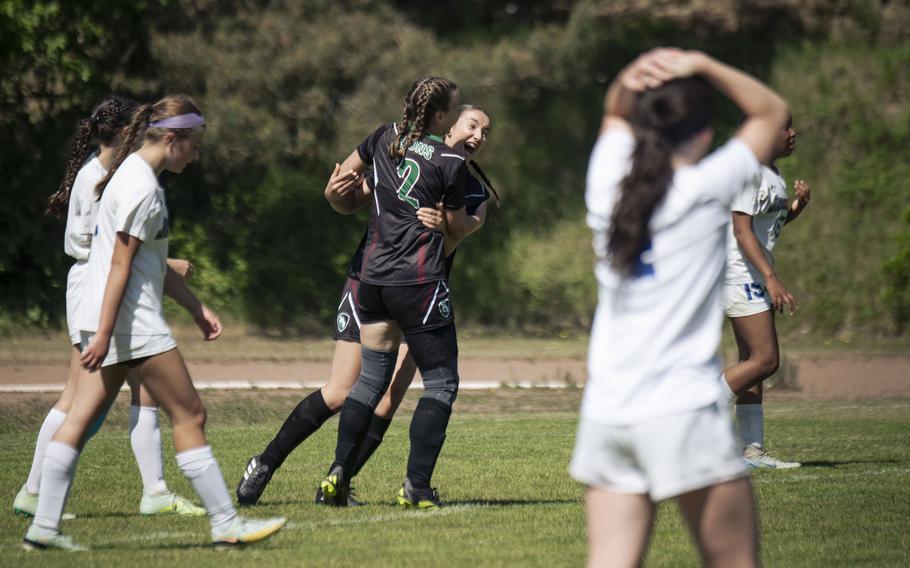 AFNORTH's Maggie Masse and Emery Koger celebrate a goal in their matchup against the Sigonella Jaguars in the 2025 DODEA European Division III soccer championships in Landstuhl, Germany on May 19, 2025.