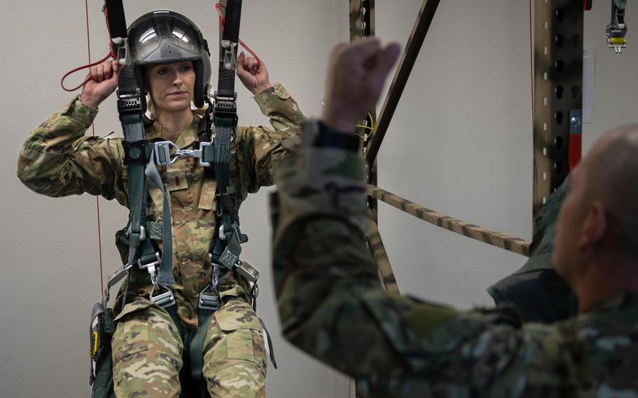 U.S. Air Force 2nd Lt. Madison Marsh goes through egress training in preparation for a familiarization flight at Nellis Air Force Base, Nev., Dec. 18, 2023. 