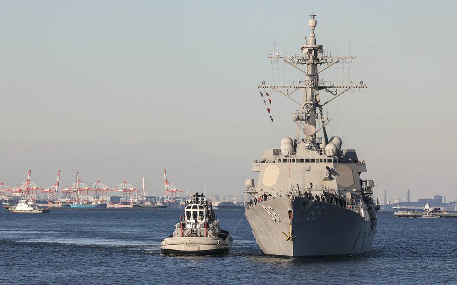 The guided-missile destroyer USS Shoup arrives at Yokosuka Naval Base, Japan, on Dec. 19, 2022. 