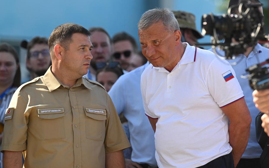 Russia’s Roscosmos space agency head Yury Borisov, right, is pictured before the launch of the Soyuz MS-22 spacecraft with Russian cosmonauts Sergey Prokopyev and Dmitri Petelin and NASA astronaut Frank Rubio at the Russian leased Baikonur cosmodrome in Kazakhstan on Sept. 21, 2022.