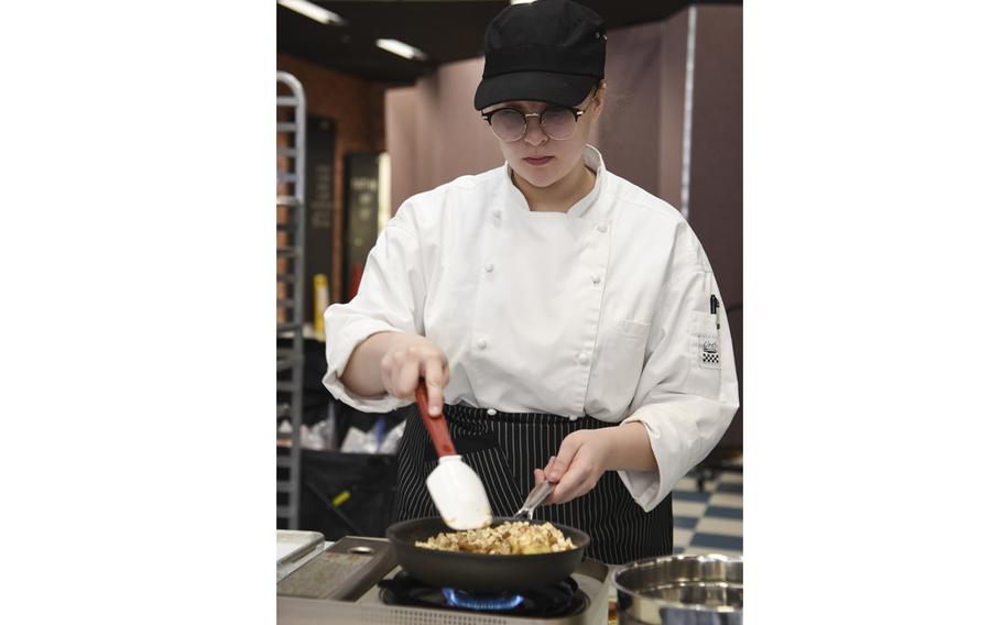 Madison Thomas, 15, a sophomore at Humphreys High School, cooks apple crisp during the Far East Culinary Arts Competition at Yokota Air Base, Japan, Feb. 7, 2023.