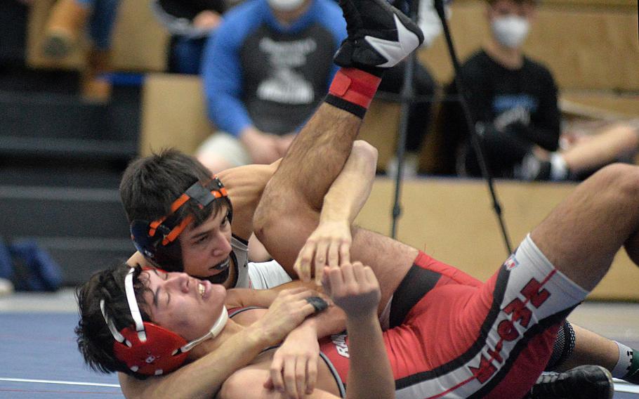 Spangdahlem’s Carson Hicks, top, beat Kaiserslautern’s Joseph Rodriguez in the 138-pound final at the high school 2022 Wrestling Tournament in Ramstein, Germany, Feb. 12, 2022.