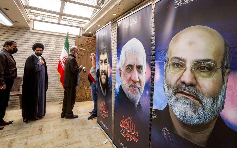 Posters depicting victims of an airstrike on the Iranian Embassy in Damascus, Syria, are displayed during a memorial service at the premises on April 3, 2024.