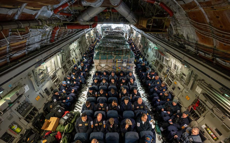 Urban Search and Rescue members from Fairfax County, Va., are boarded onto a C-17 Globemaster III on Dover Air Force Base, Del., on Feb. 7, 2023. The U.S. Agency for International Development is mobilizing emergency humanitarian assistance to respond to the devastating impacts following the earthquake that hit Turkey. 