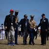 A Marine escorts Battle of Iwo Jima veterans during the Reunion of Honor ceremony March 25, 2023, at Iwo Jima, Japan.