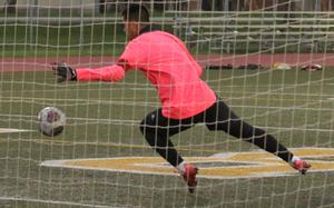 King keeper Kent Monto makes one of his 19 saves against Perry.