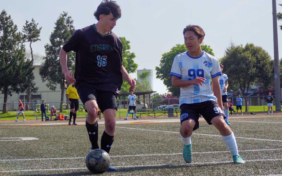 Edgren's Ethan Wong looks for room against Osan's John Krabbe.