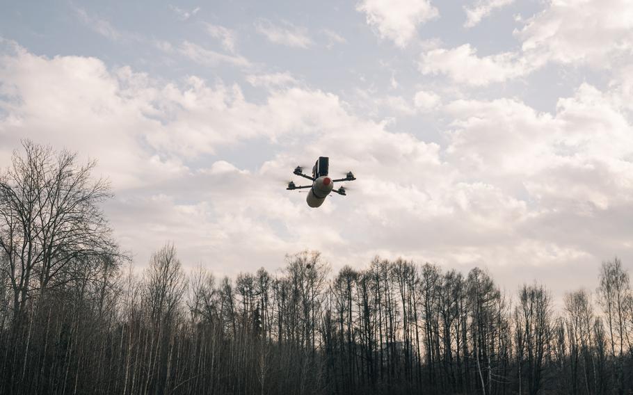 A homemade FPV drone hovers during testing.