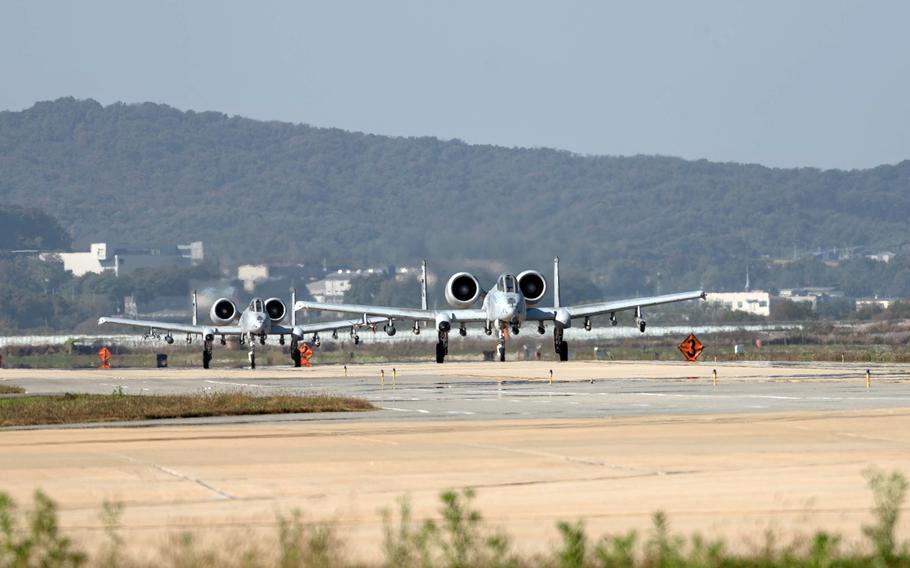A-10C Thunderbolt IIs from the 25th Fighter Squadron take the runway ahead of Vigilant Defense at Osan Air Base, South Korea, Oct. 29, 2023. 