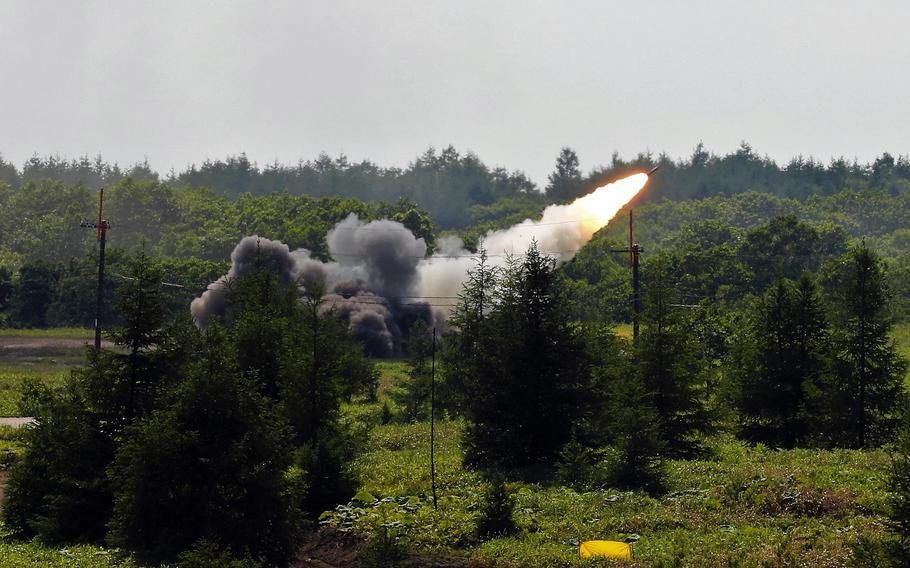 American soldiers fire a High Mobility Artillery Rocket System on the Japanese island of Hokkaido during a large-scale exercise that concluded Wednesday, July 7, 2021. 