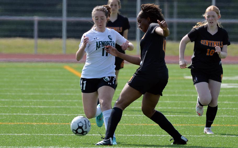 Spangdahlem’s Naomi Legett, right, clears the ball in front of AFNORTH’s Shannon O’Connor in a girls Division III game on opening day of the DODEA-Europe soccer championships in Ramstein, Germany. AFNORTH won the game 3-0.