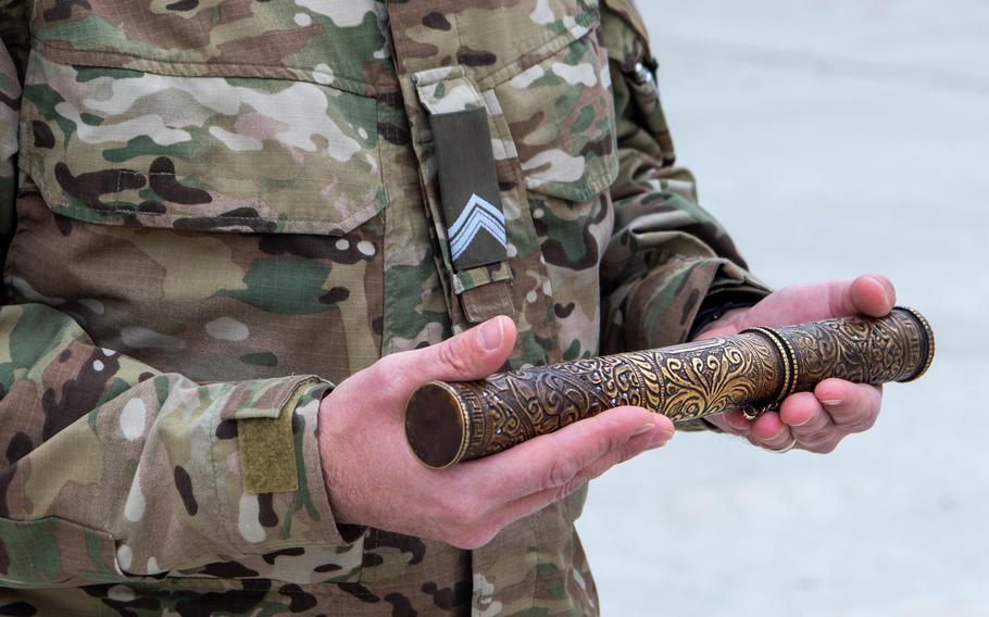 Deployed Dutch soldiers prepare to pack a ''tumar,'' or document sleeve, handed down between units throughout the years in Afghanistan, for shipping to the Rijksmuseum in Amsterdam. The soldiers held a ceremony for ending their mission at Camp Marmal in Afghanistan's north on May 16, 2021.

Royal Netherlands Army