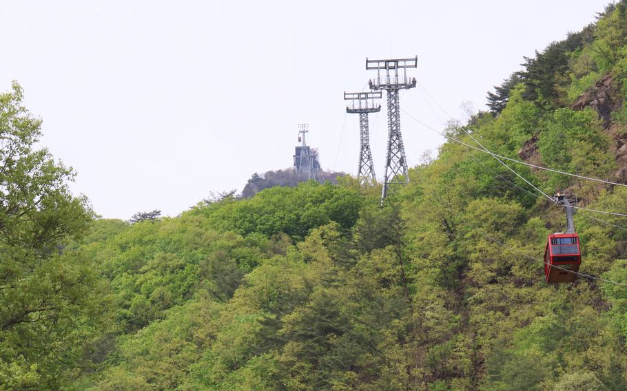 A cable car take visitors to the summit of Baegam Mountain in Hwacheon County, South Korea, May 2, 2023.