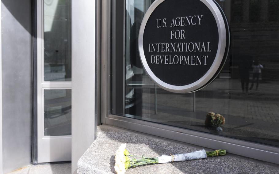 A bouquet of white flowers placed outside the headquarters of the United States Agency for International Development in Washington.
