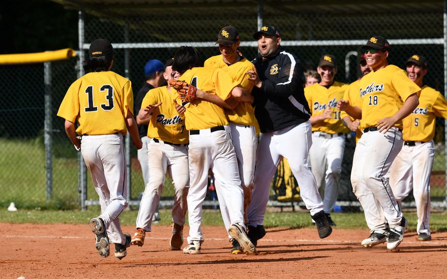 The Stuttgart bench clears in celebration after starting pitcher Marcus Laine wins the game after pitching a complete game with 15 strikeouts in a victory against Wiesbaden during the 2022 DODEA-Europe baseball championships.