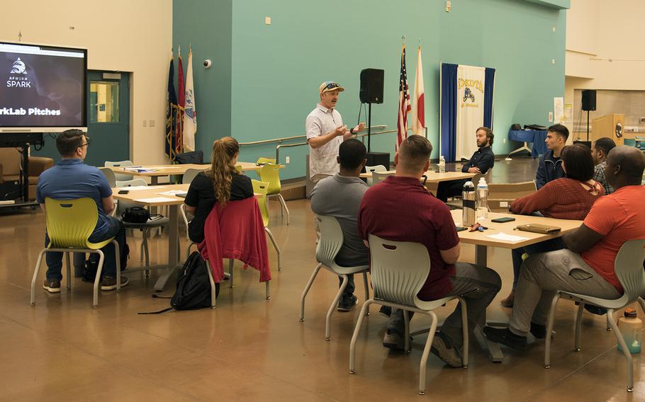 Maj. Michael Girolami, a Huey instructor pilot for the 459th Airlift Squadron, pitches an idea for improving Air Force retention during an AFWERX-sponsored SparkLab workshop at Yokota Air Base, Japan, Friday, June 23, 2023.