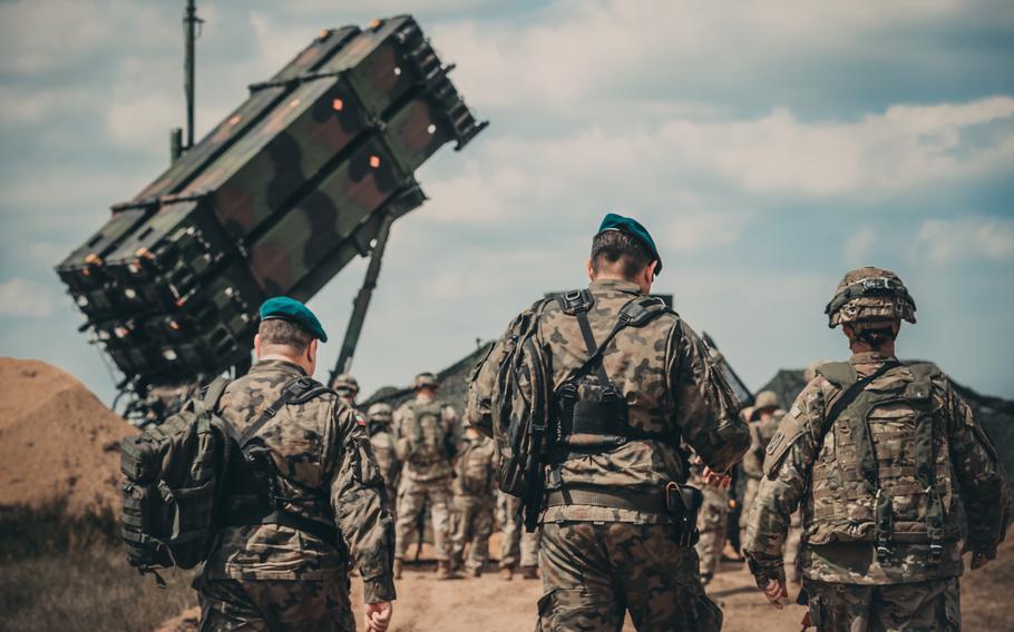 Soldiers from the U.S. and Polish armies walk to the site of Patriot missile system near Drawsko Pomorskie, Poland, in 2018.