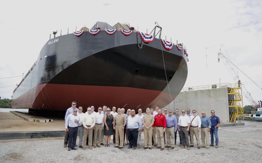 U.S. Navy, Bollinger Shipyards, General Dynamics Electric Boat and Bristol Harbor Group representatives in front of the Holland.