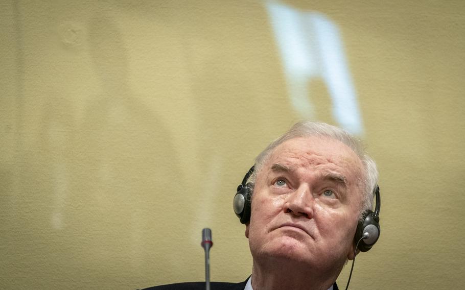 Former Bosnian Serb military chief Ratko Mladic sits in the court room in The Hague, Netherlands, Tuesday, June 8, 2021, where the United Nations court delivers its verdict in the appeal of Mladic against his convictions for genocide and other crimes and his life sentence for masterminding atrocities throughout the Bosnian war.