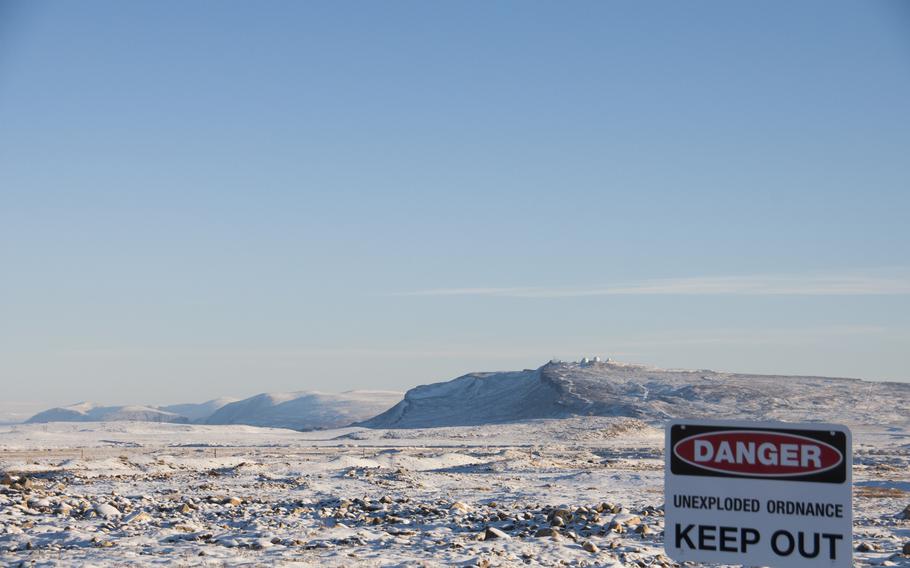 The base once hosted more than 10,000 U.S. military personnel, including soldiers using mortars and ground-to-air missiles. “As with any ordnance, all of it did not detonate,” according to base literature. In the distance, top right, is the Ballistic Missile Early Warning System, or BMEWS.