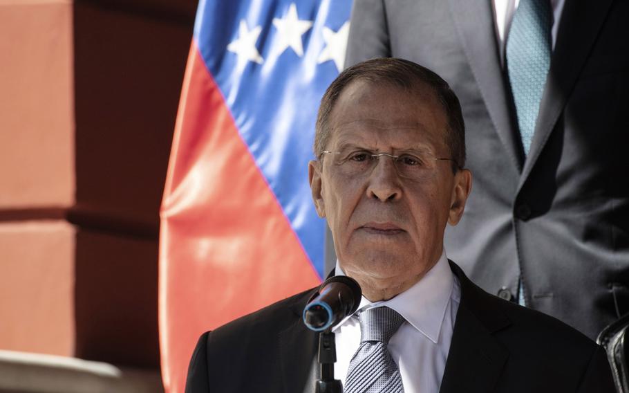 Sergei Lavrov, Russia’s foreign minister, listens while Delcy Rodriguez, Venezuela’s vice president, not pictured, speaks at Miraflores Palace in Caracas, Venezuela, on Feb. 7, 2020. Russians using smart TVs reported seeing something atypical: A message appeared instead of the usual channels. The apparent hack, targeting ordinary Russians sitting by their TVs or looking things up on their search engines, broke through the pro-Moscow messaging as Russia celebrates Victory Day.