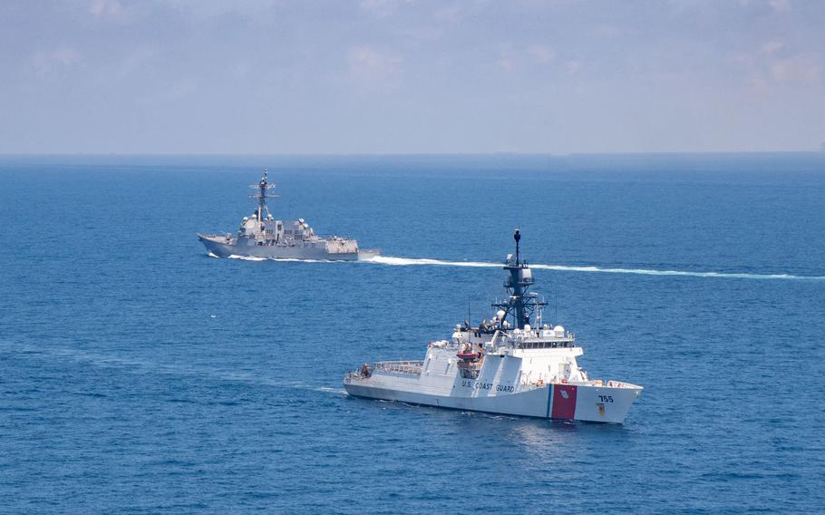 The U.S. Coast Guard cutter Monro and U.S. Navy guided-missile destroyer USS Kidd transit the Taiwan Strait, Friday, Aug. 27, 2021.