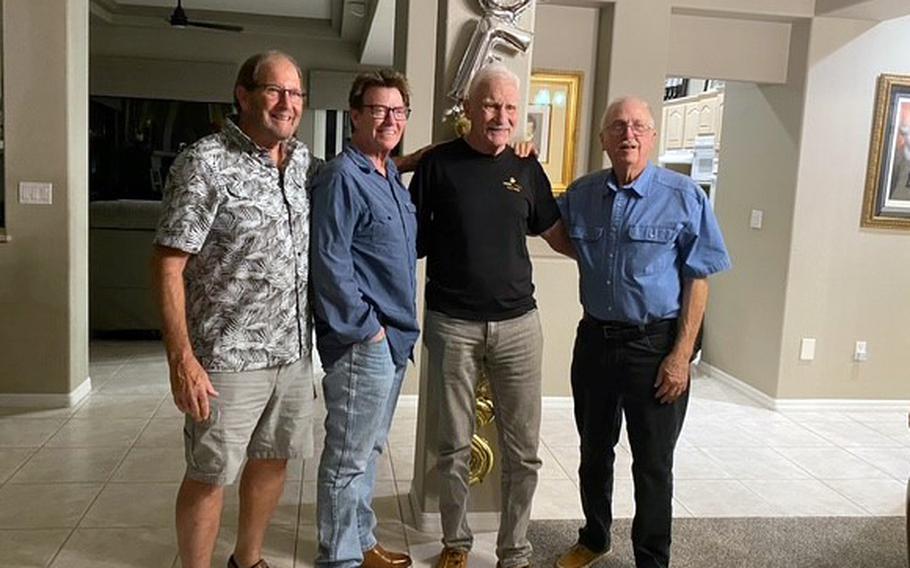 Former Marines pose for a photo.