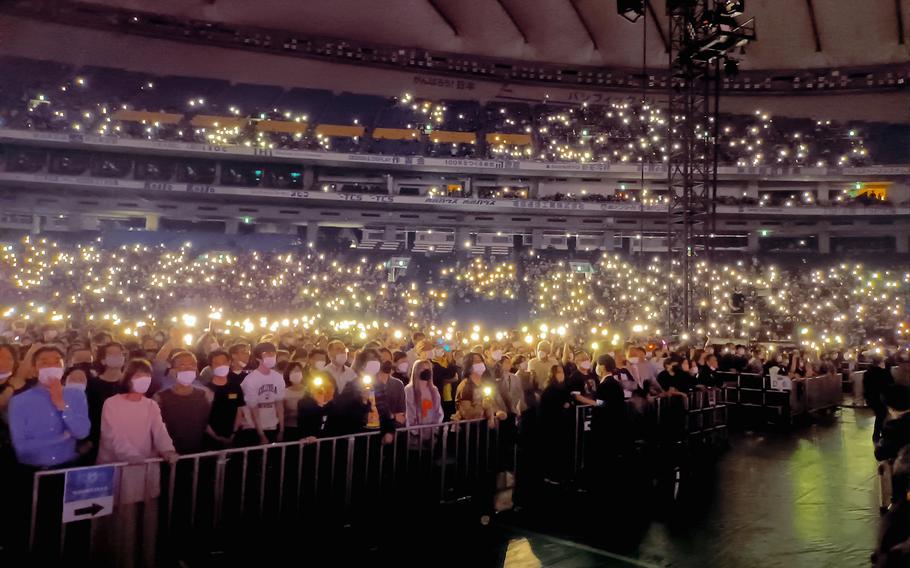 An audience at Tokyo Dome watches Kiss perform what is expected to be the Rock and Roll Hall of Famers' farewell performane in Japan, Nov. 30, 2022. 