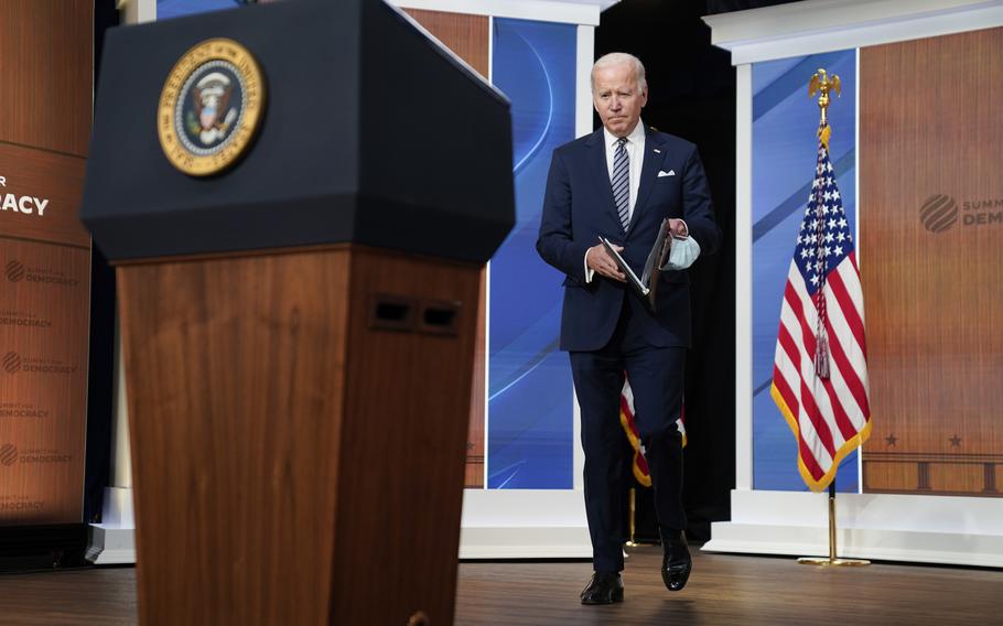 President Joe Biden arrives to deliver closing remarks to the virtual Summit for Democracy, in the South Court Auditorium on the White House campus, Friday, Dec. 10, 2021, in Washington. 