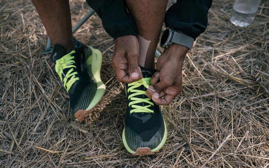 German Silva, a retired long distance runner, ties his shoe laces after changing of paint during a meal break. The 52-year-old athlete is now running through Mexico to “show us the greatness of our country” into stretches of 40 and 50 kilometers per day, resting just one day per week. 