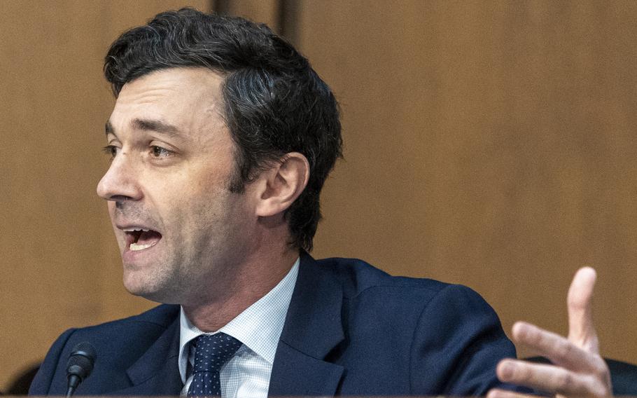Ossoff seated and speaking.